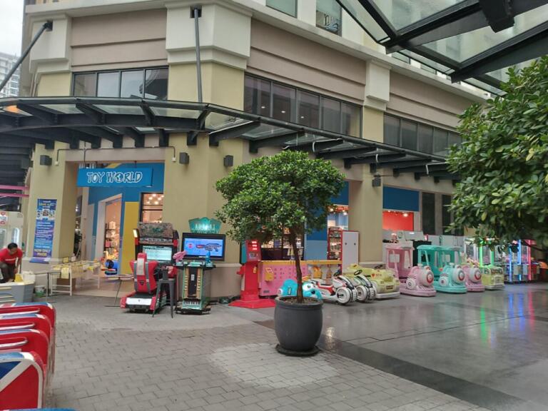 Outdoor arcade with toy rides and games outside "Toy World.
